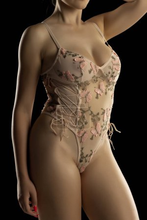 Photo for Torso Of Sexy Young Woman In Lingerie Lace Transparent  One-piece Babydoll Bodysuit On Black Studio Background - Royalty Free Image
