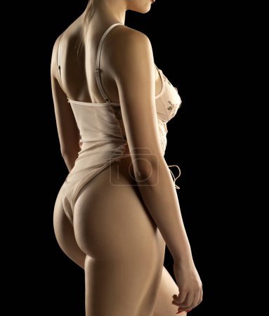 Foto de Torso de Mujer Joven Sexy En Lencería Encaje Transparente Babydoll Bodysuit De Una Pieza En Fondo Negro Estudio. Vista Sider - Imagen libre de derechos