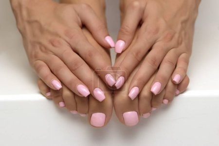 Photo for The picture of female legs and hands after pedicure and manicure. - Royalty Free Image