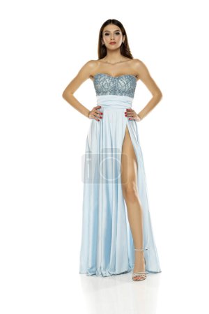 Photo for Full length of gorgeous elegant sensual brunette woman wearing fashion blue evening dress isolated on white studio background - Royalty Free Image
