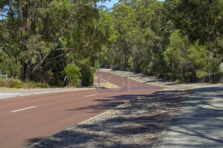 Street View of hilly Maidment Parade, Dalyellup, Western Australia with the cycleway, adjacent to the Kalgulup Regional Parklands ,and containing the spacious Ranch size blocks of land with large houses and trees.