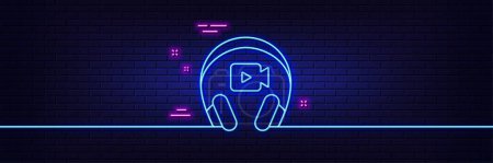 Illustration for Neon light glow effect. Headphones with video camera line icon. Online conference sign. Virtual education symbol. 3d line neon glow icon. Brick wall banner. Headphones outline. Vector - Royalty Free Image