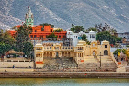 Photo for PUSHKAR, INDIA - MARCH 3 2018: Panoramic view from the house terrace to the temple and coast by the holly lake. - Royalty Free Image