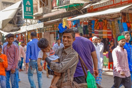 Photo for AJMER, INDIA - MARCH 3 2018: Colorful scene of beautiful people on the Dargah Bazar road of the old city center. - Royalty Free Image