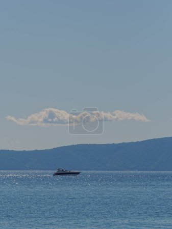Photo for Motor boat sailing Adriatic sea in Croatian waters on beautiful autumn weather. - Royalty Free Image
