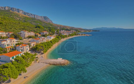 Photo for Aerial view of sunny pebble beach in Tucepi town on Adriatic coast in Croatia. - Royalty Free Image