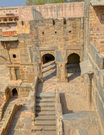 Photo for A view across the giant Ancient Chand Baori Stepwell in the Historical Village Abhaneri in Rajasthan state in India. - Royalty Free Image