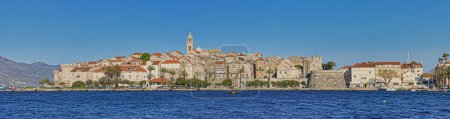 Photo for KORCULA, Croatia - APRIL 24, 2021: Panoramic view of the medieval old town center on island peninsula during pandemic without tourists and yachts - Royalty Free Image