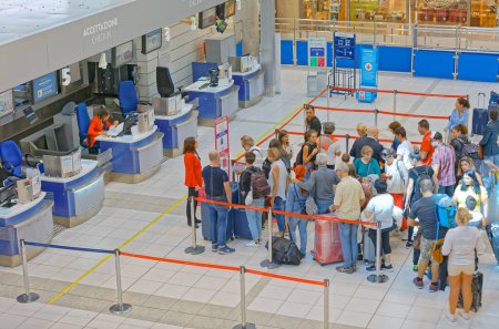 Photo for BARI, ITALY - September 26, 2019 Aerial view of people waiting in the check-in lines at the Karol Wojtyla International Airport. - Royalty Free Image