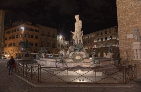 Photo for FLORENCE, ITALY - September 25, 2019 The Fountain of Neptune in the Piazza della Signoria, in front of the Palazzo Vecchio by night. - Royalty Free Image
