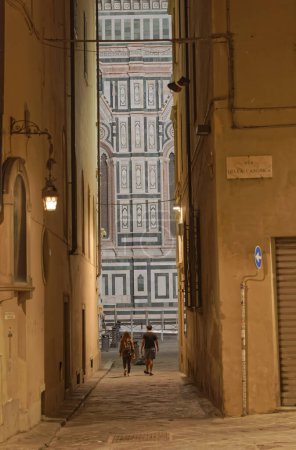 Photo for FLORENCE, ITALY - September 25, 2019 Narrow street in old city center by night. - Royalty Free Image