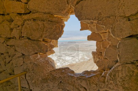 Photo for MASADA, ISRAEL - MAY 21, 2016: Hole in the wall at Masada ruins of the ancient fortress in southern Israels Judean desert. - Royalty Free Image