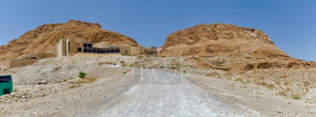 Photo for Tourists visiting Masada ruins of the ancient fortress in southern Israels Judean desert. - Royalty Free Image
