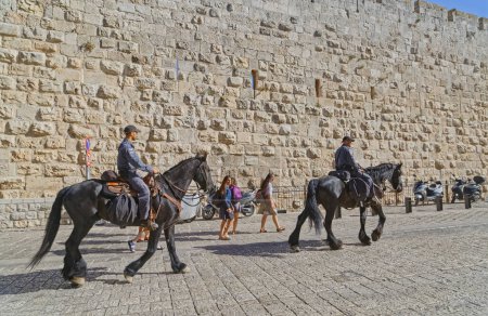 Photo for JERUSALEM, ISRAEL - MAY 18, 2016: Policemen on horseback at the Jaffa Gate entrance to western edge of the Old City. - Royalty Free Image