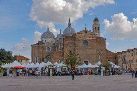 Photo for PADUA, ITALY - APRIL 01 2023: People passing in front of Abbazia di Santa Giustina church. - Royalty Free Image