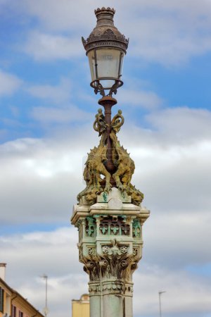 PADUA, ITALY - APRIL 03 2023: Street lamp in front of Basilica of Saint Anthony at Piazza del Santo.