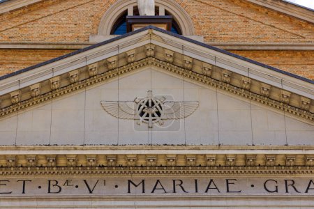 Photo for SAN DONA DI PIAVE, ITALY - July 28, 2023: Closeup of Eye of Providence symbol on the facade of Duomo di Santa Maria delle Grazie Cathedral. - Royalty Free Image