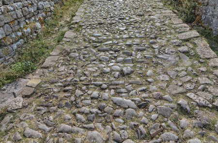 Photo for Aged pathway paved with round pebbles leading to the historical Rosafa Fortress in Skadar. - Royalty Free Image