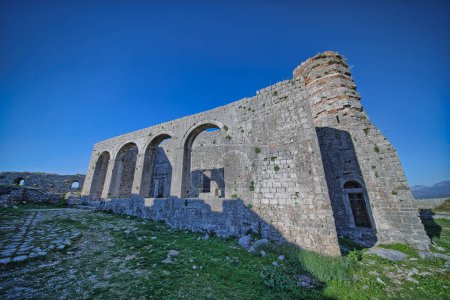 Photo for Architectural remnants of a building that served as both a mosque and church, showcasing pillars and arches at the peak of Rozafa fortress in Shkoder, Albania. - Royalty Free Image