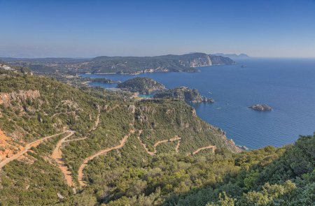 Photo for Panoramic view of Corfus coastline captured from Angelokastro with a glimpse of the rocky shores, cliffs, and beach. - Royalty Free Image