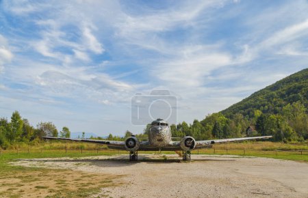 Photo for ZELJAVA, CROATIA - November 6, 2023: The Douglas C-47 B Dakota, tail number 71212 of the Yugoslav Air Force, stands as a canvas for graffiti at the abandoned Zeljava Airfield. - Royalty Free Image