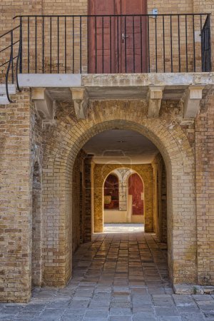 Photo for CORFU, GREECE - October 21, 2022: The rustic beauty of the arched passageway within the Old Fortress of Corfu, showcasing historical architecture. - Royalty Free Image