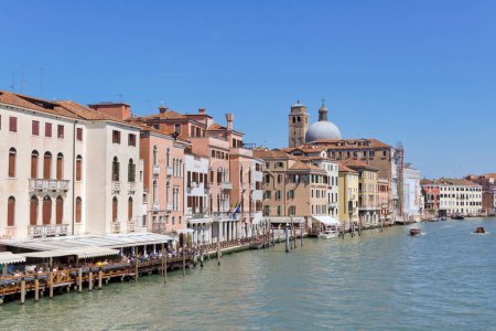 Photo for VENICE, ITALY - APRIL 10 2023: Boats passing the Grand Canal view from Stone Arch bridge Ponte degli Scalzi. - Royalty Free Image