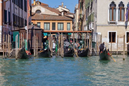 Photo for VENICE, ITALY - APRIL 10 2023: Gondola boarding passengers at the Grand Canal. - Royalty Free Image