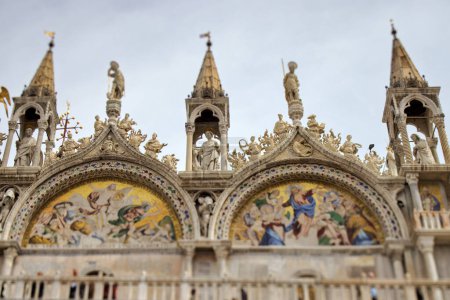 Photo for VENICE, ITALY - APRIL 11 2023: Intricate decorative elements on the facade of Saint Marks Basilica, offering a glimpse into rich architectural heritage. tilt shift lens - Royalty Free Image