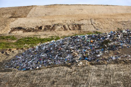 Photo for Open air garbage dump. Plastic waste pollution. Recycling junk. Consumerism - Royalty Free Image