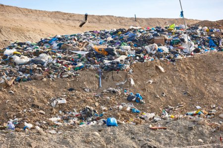 Photo for Open air garbage dump. Plastic pollution. Recycling junk. Consumerism - Royalty Free Image