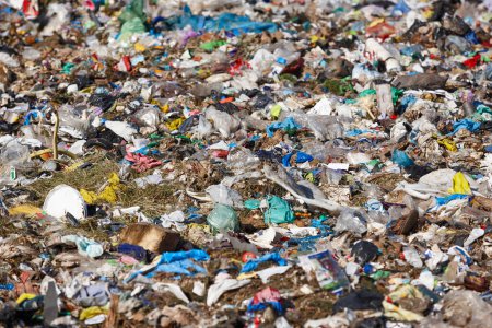 Photo for Open air garbage dump. Plastic pollution. Recycling junk. Consumerism - Royalty Free Image