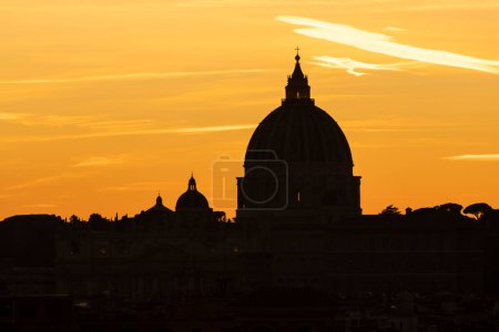 St. Peter dome masterpiece at sunset. Vatican state. Rome, Italy
