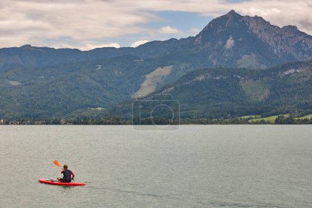 Photo for Padling on Wolfgangsee lake. Salzburgerland. Austrian mountain landscape - Royalty Free Image