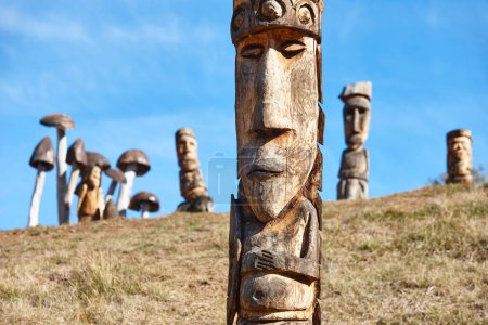 Photo for Handmade wood work. Totems heads. Carpenter. Sculptures in exterior - Royalty Free Image