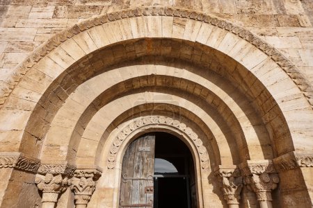 Romanesque portico of St. Maria de Porqueres. Banyoles lake. Girona