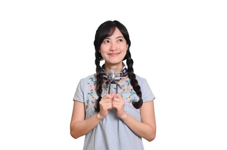 Téléchargez les photos : Portrait beautiful young asian woman smile in denim dress with spoon and fork on white background - en image libre de droit