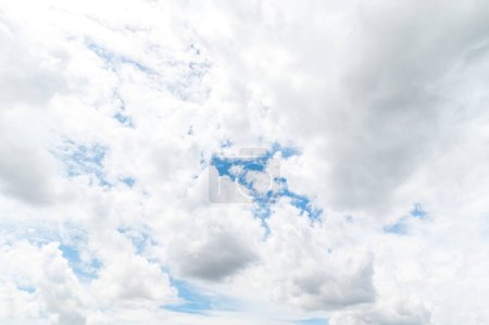 Photo for Beautiful white fluffy clouds in blue sky. Nature background from white clouds in sunny day. - Royalty Free Image