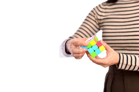 Foto de Female hands holding a puzzle cube. - Imagen libre de derechos