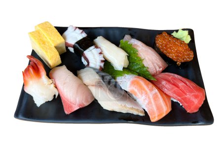 Foto de The premium sushi set place on black plate - Imagen libre de derechos