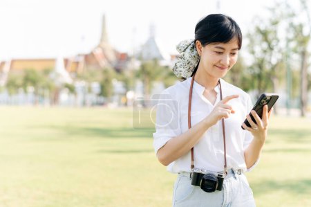 Photo for Portrait beautiful young asian woman with smartphone on summer holiday vacation trip in Thailand - Royalty Free Image