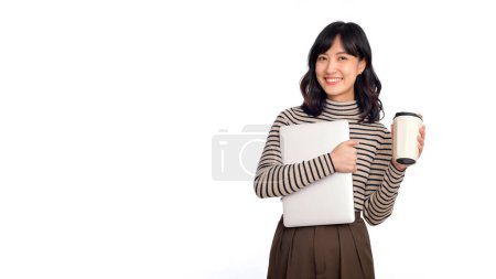 Foto de Beautiful young Asian woman on sweater clothing holding laptop pc computer and coffee cup with smile face, isolated on white background. - Imagen libre de derechos