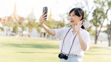 Photo for Portrait beautiful young asian woman with smartphone on summer holiday vacation trip in Thailand - Royalty Free Image