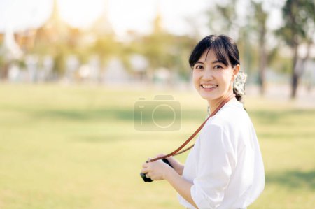 Photo for Asian woman traveler using camera. Asia summer tourism concept - Royalty Free Image