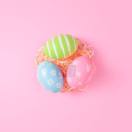 Photo for Happy Easter holiday greeting card concept. Colorful Easter Eggs pastel pink background. Top view, flat lay, copy space. - Royalty Free Image