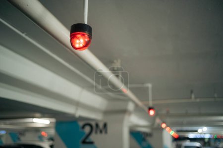 Photo for Light indicator sign control by electronic smart technology system interior of carpark. Equipment for automobile garage indoor device available ceiling in parking area show by green red signal. - Royalty Free Image