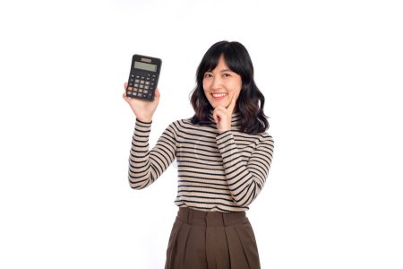 Téléchargez les photos : Young Asian woman casual uniform holding calculator. Business and financial concept. - en image libre de droit