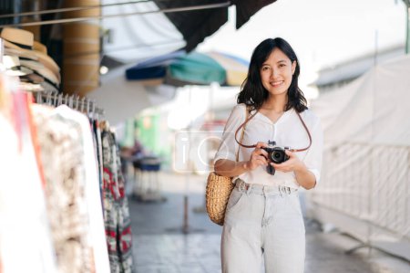 Photo for Portrait of young beautiful woman with camera explore street in Bangkok, Thailand - Royalty Free Image