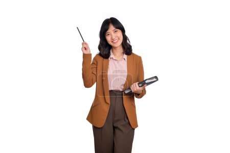 Foto de Happy young asian business woman holding pencil and notebook isolated on white background. - Imagen libre de derechos