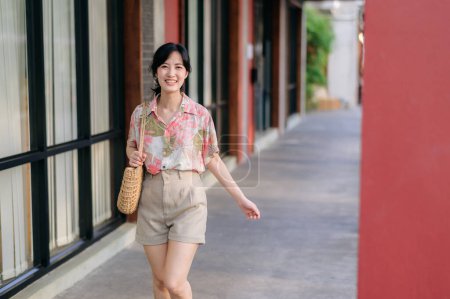 Photo for Portrait beautiful asian young woman on summer holiday vacation trip in Thailand. Young hipster female tourist sightseeing summer urban Bangkok destination. Asia summer tourism concept. - Royalty Free Image